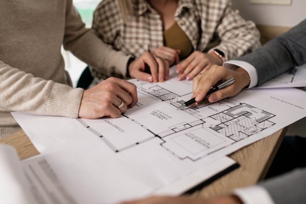 Reviewing architectural building plans for new home construction project in Melbourne